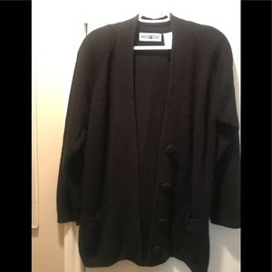 Black ribbed knit sweater with pockets